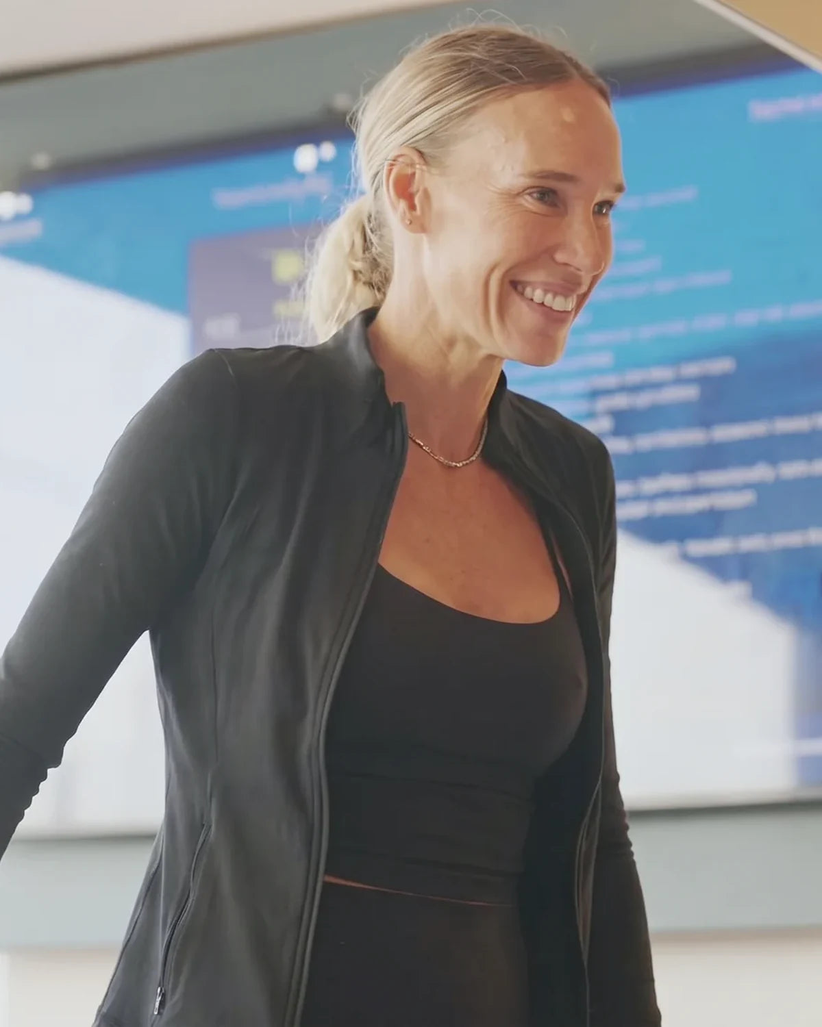Jonna Wallberg smiling, out at the counter after her morning session
