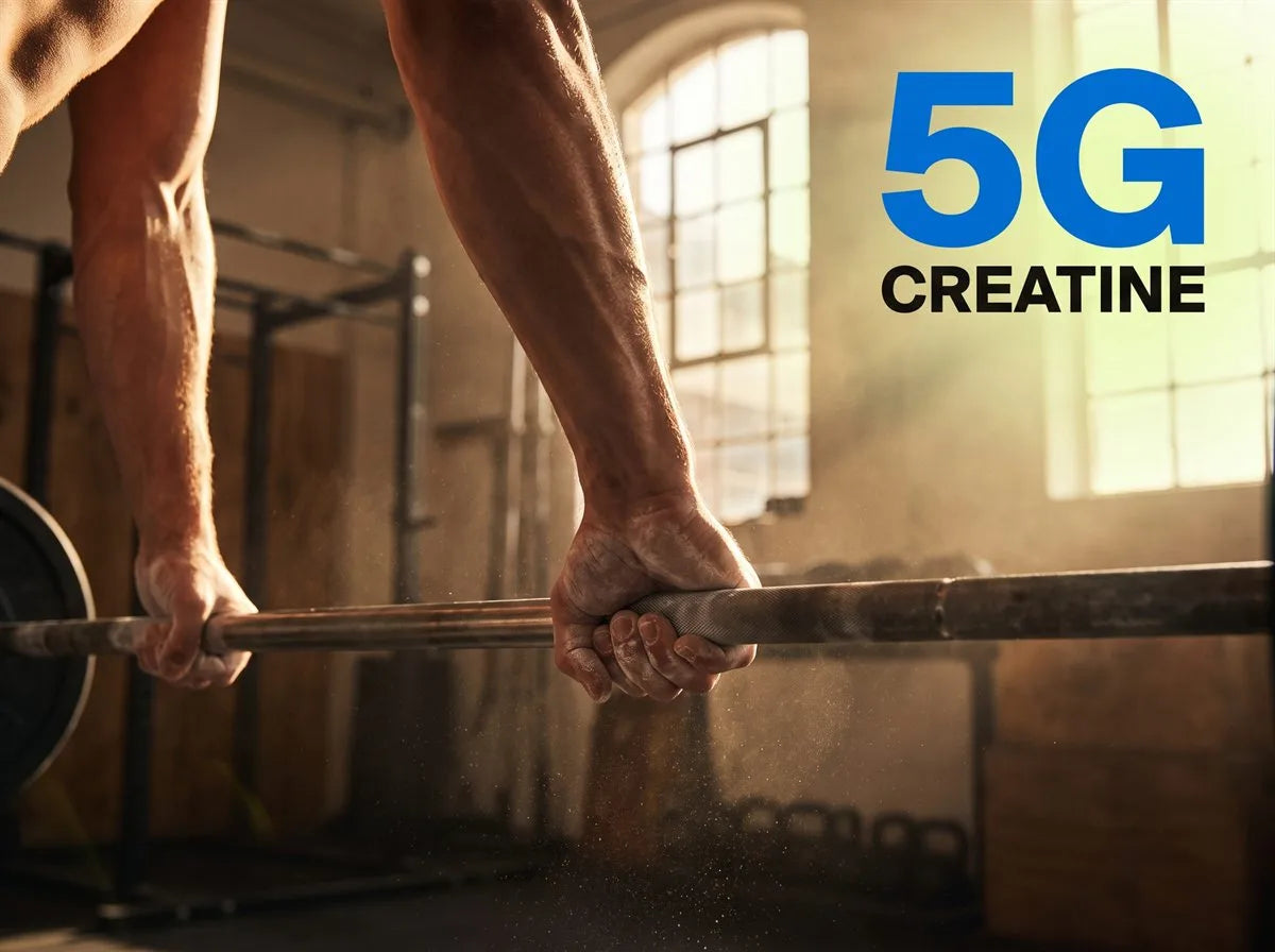 5g creatine. Chalked hands locked on a barbell at the top of the last rep, in a gym full of late-afternoon light