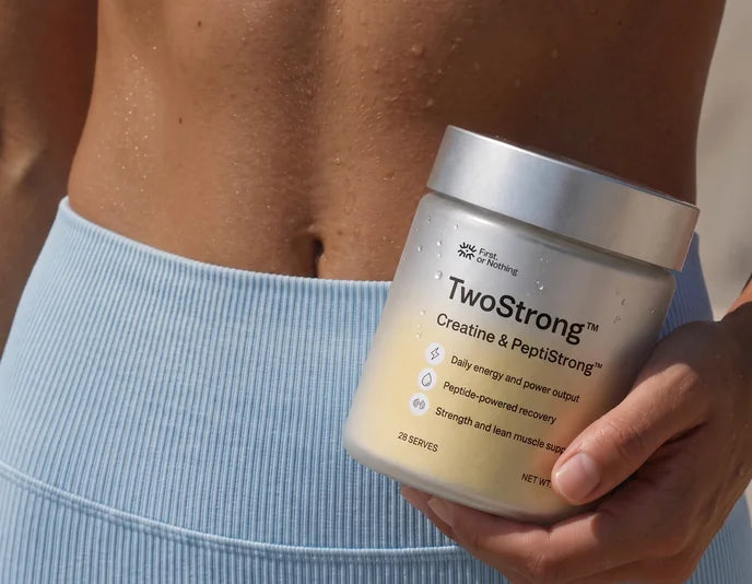 A jar of TwoStrong held at the waist