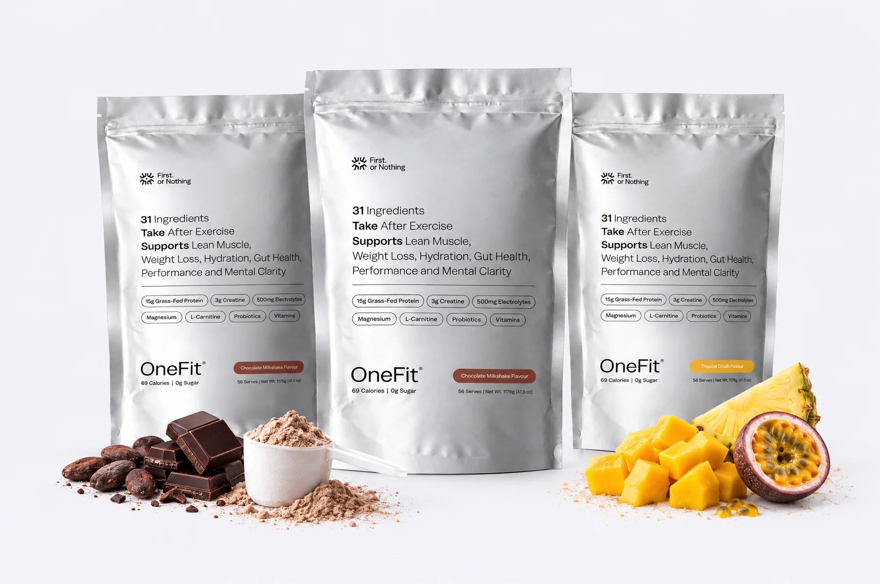 Three OneFit 4.7 pouches, two Chocolate Milkshake and one Tropical Crush, with dark chocolate, cacao, a scoop of powder, mango, pineapple and passionfruit