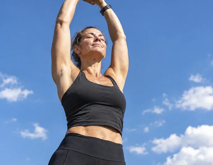Stretching under a blue sky